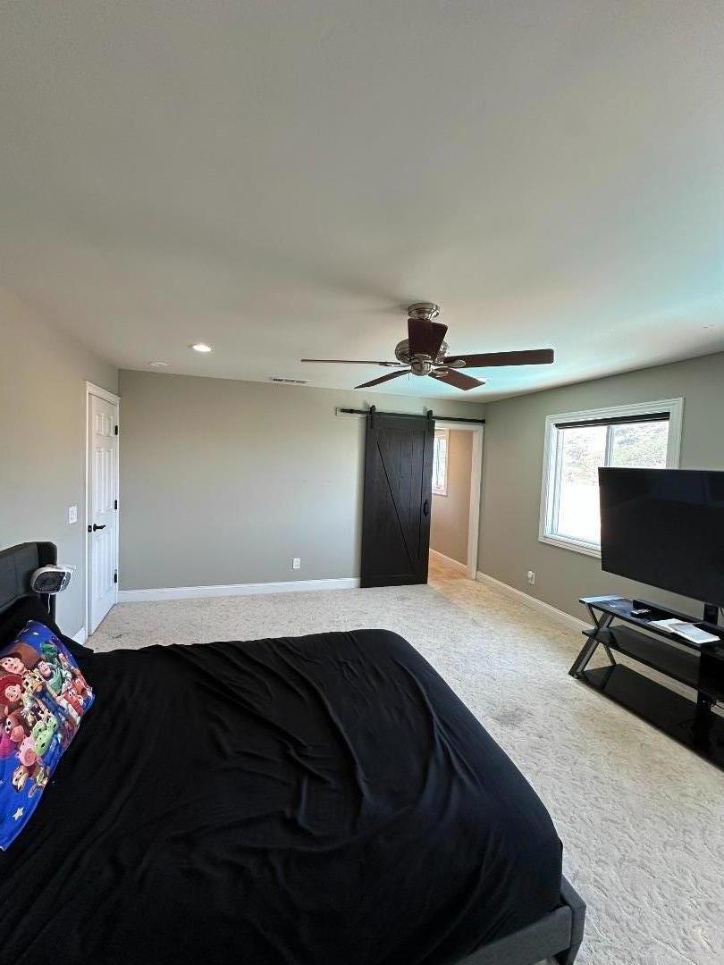 50950 Pine Canyon Road King City, CA 93930 - Photo 9 of 23 a bedroom with a bed and a flat screen tv