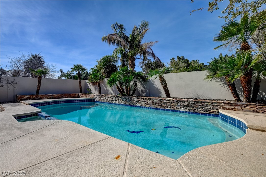 4207 Ridgecrest Drive Las Vegas, NV 89121 - Photo 26 of 27 View of swimming pool featuring a fenced backyard and patio surround