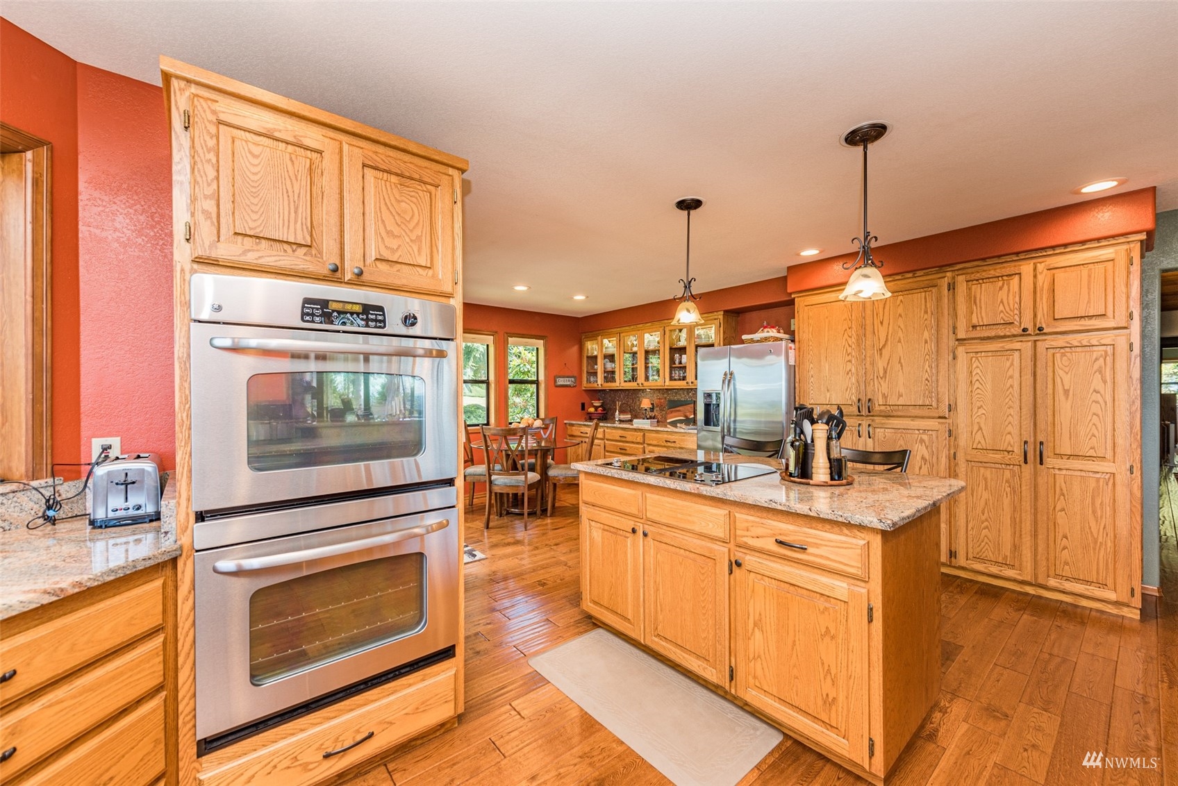 1313 Doe Run Road Sequim, WA 98382 - Photo 12 of 40 a kitchen with a stove a sink and a microwave