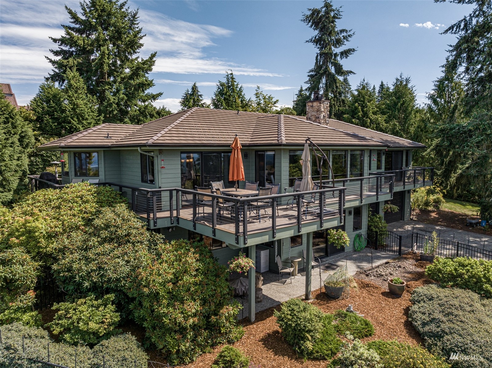 1313 Doe Run Road Sequim, WA 98382 - Photo 2 of 40 a front view of a house with garden