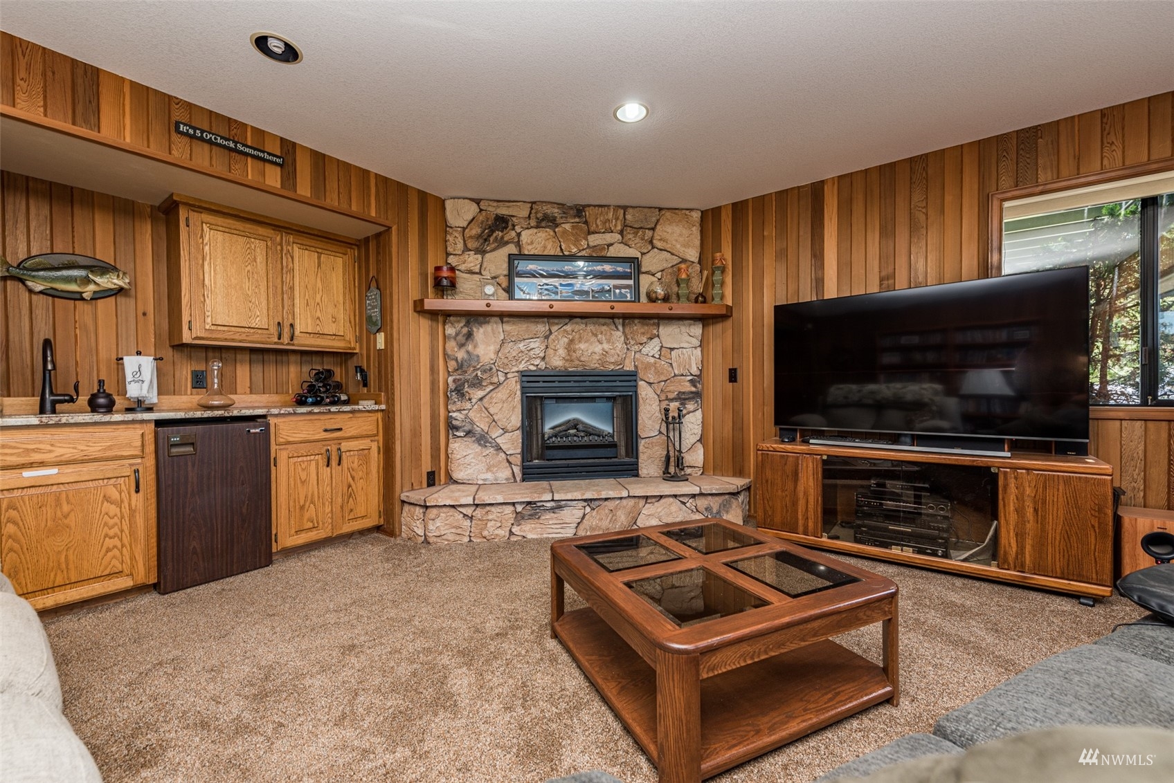 1313 Doe Run Road Sequim, WA 98382 - Photo 24 of 40 a kitchen with furniture and a fireplace