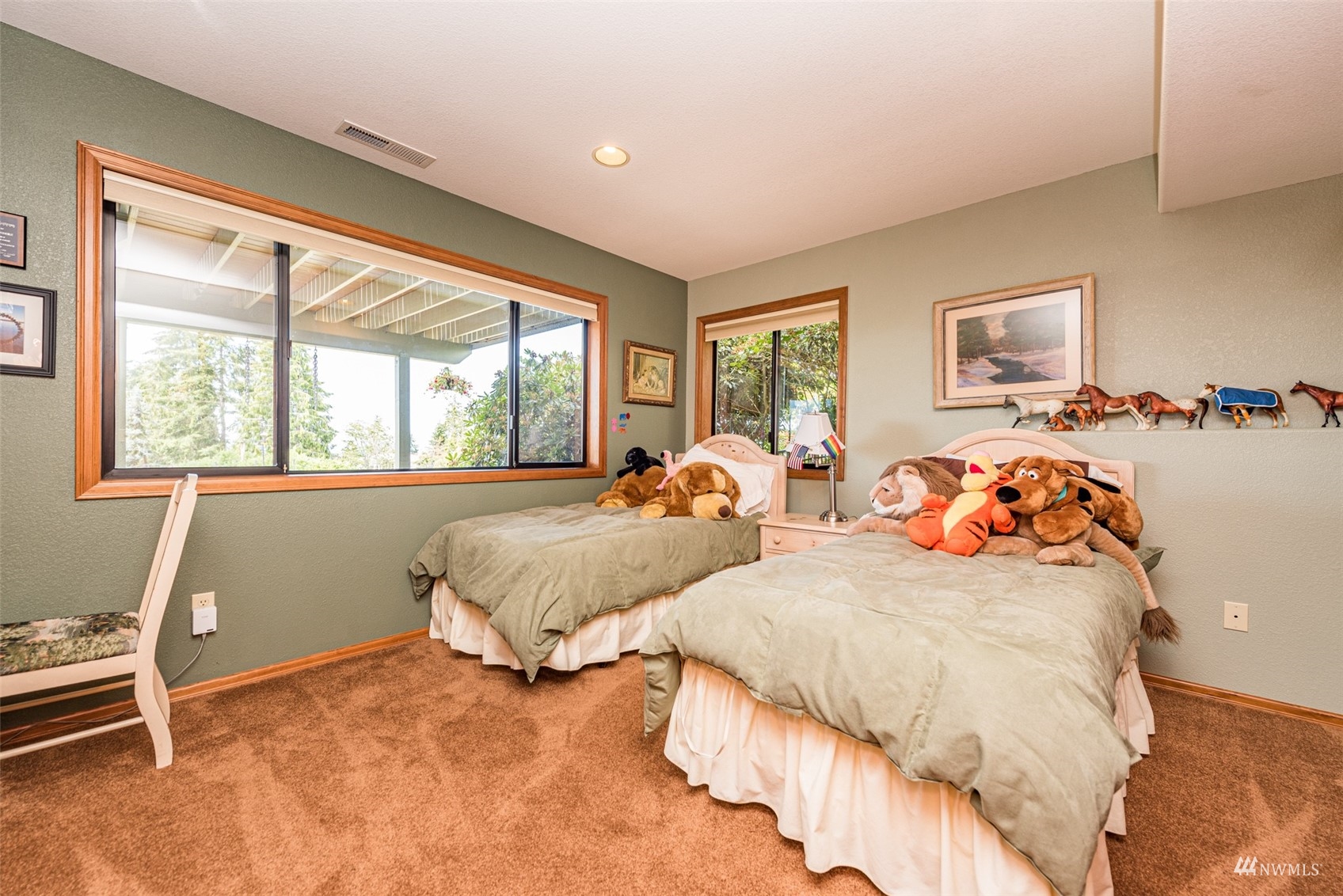 1313 Doe Run Road Sequim, WA 98382 - Photo 25 of 40 a bedroom with two beds and a window