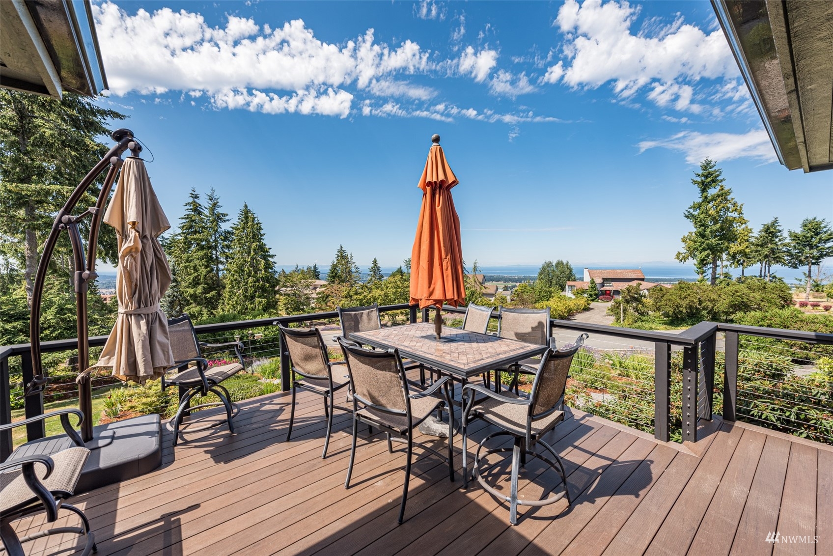 1313 Doe Run Road Sequim, WA 98382 - Photo 30 of 40 a view of a dinning tables and chairs on the deck