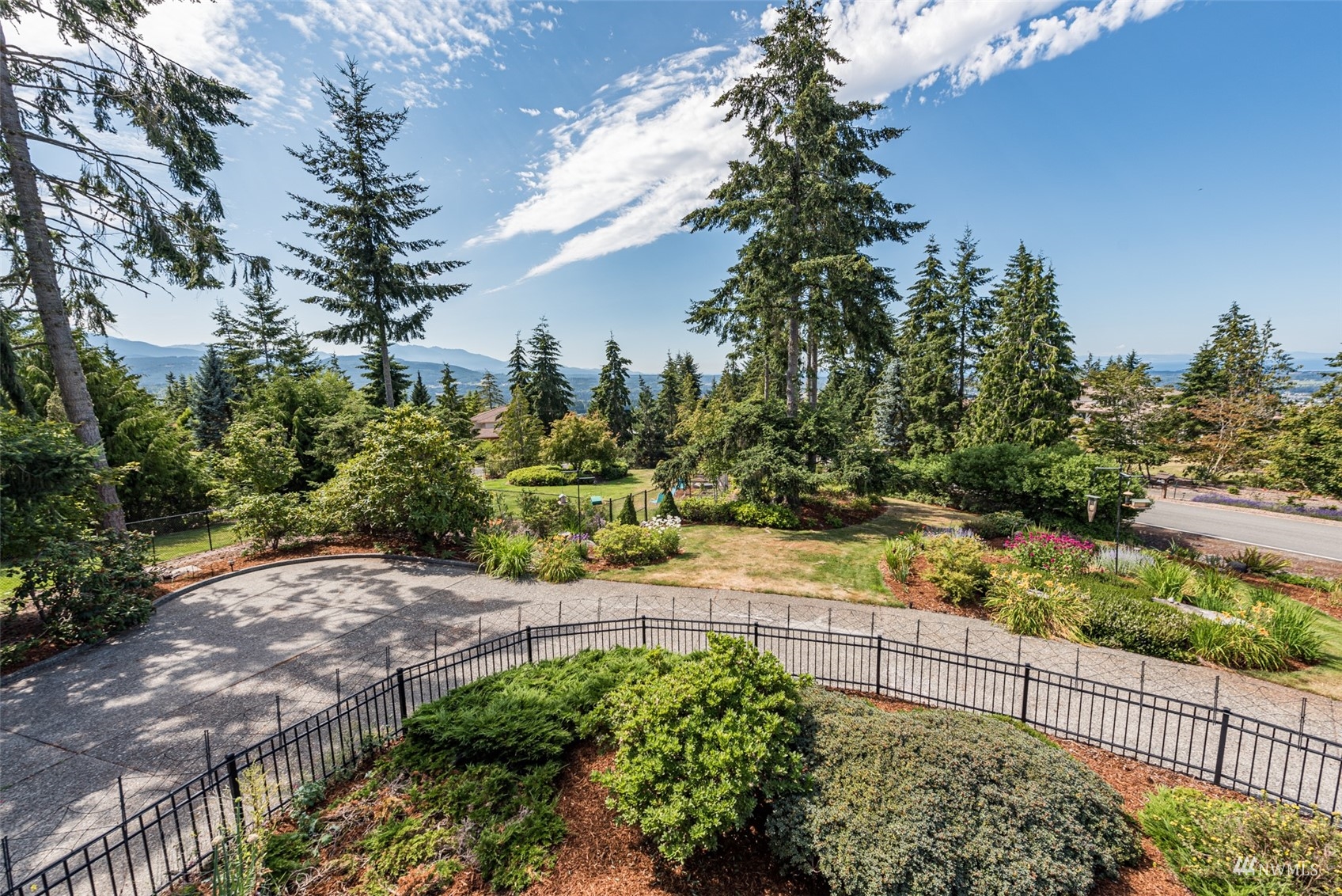 1313 Doe Run Road Sequim, WA 98382 - Photo 31 of 40 a view of a pathway with a wrought fence