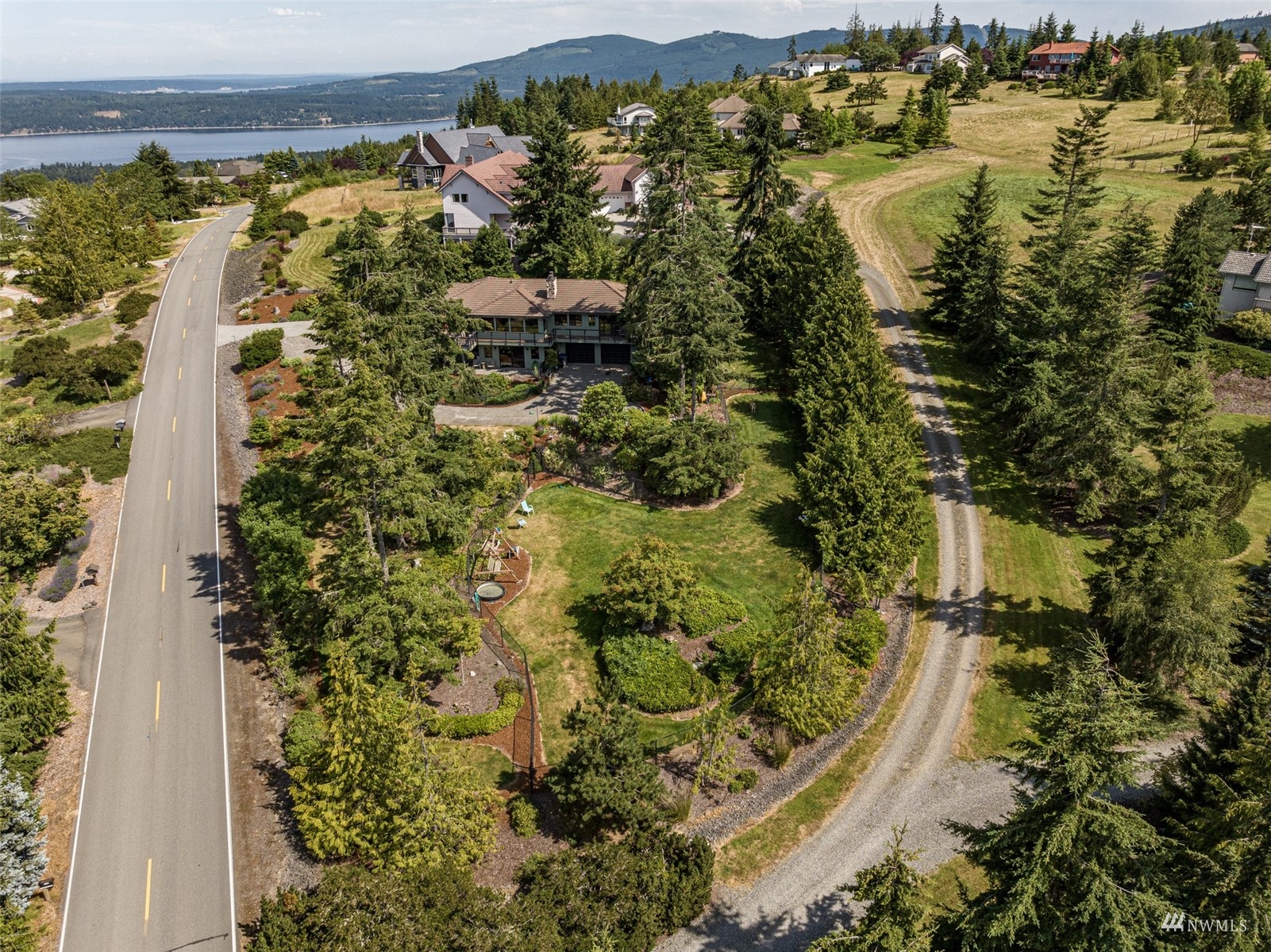 1313 Doe Run Road Sequim, WA 98382 - Photo 34 of 40 an aerial view of residential houses with outdoor space