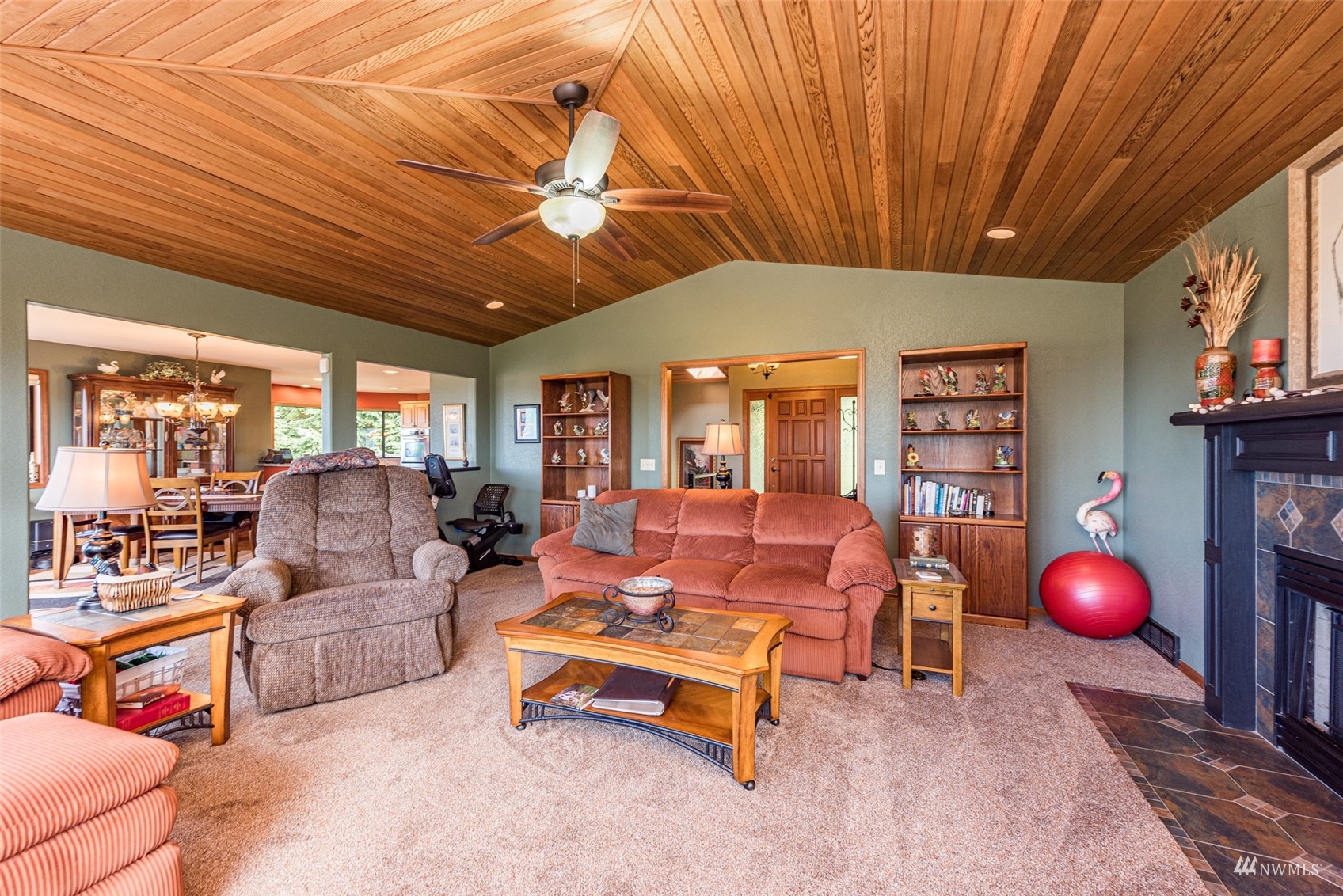 1313 Doe Run Road Sequim, WA 98382 - Photo 8 of 40 a living room with furniture and a chandelier