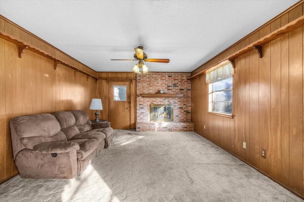 601 State Street Weatherford, TX 76086 - Photo 6 of 38 a living room with furniture and a fireplace