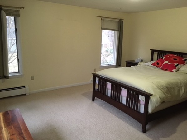 9 West Knoll Road Andover, MA 01810 - Photo 14 of 16 a bedroom with a bed and a window