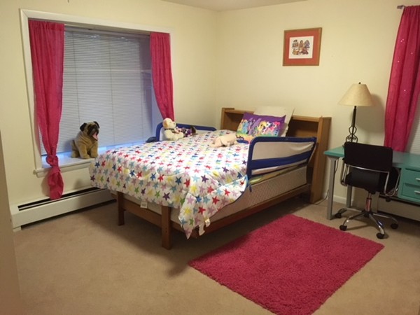 9 West Knoll Road Andover, MA 01810 - Photo 15 of 16 a bedroom with a bed and a chair