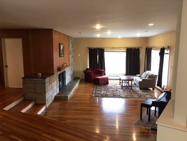 9 West Knoll Road Andover, MA 01810 - Photo 6 of 16 a living room with furniture window and wooden floor