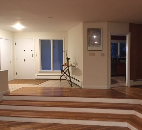 9 West Knoll Road Andover, MA 01810 - Photo 7 of 16 a view of entryway and hall with wooden floor