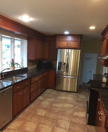 9 West Knoll Road Andover, MA 01810 - Photo 10 of 16 a kitchen with granite countertop a refrigerator and a sink