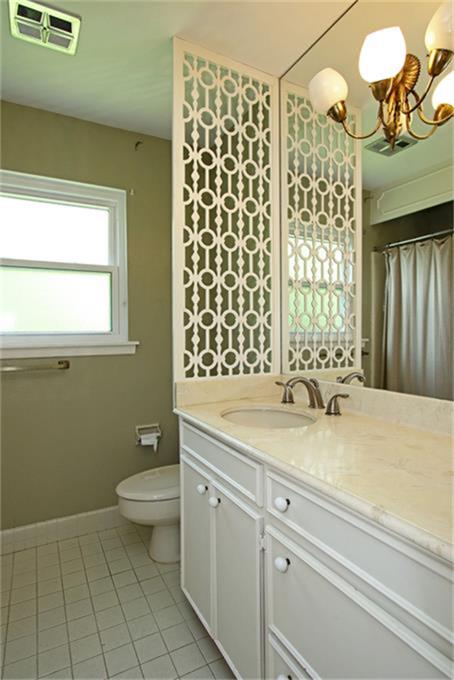 2332 Suffolk Drive Houston, TX 77027 - Photo 13 of 20 a bathroom with a sink a toilet and a shower