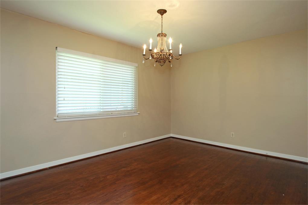 2332 Suffolk Drive Houston, TX 77027 - Photo 5 of 20 a view of a room with windows and chandelier