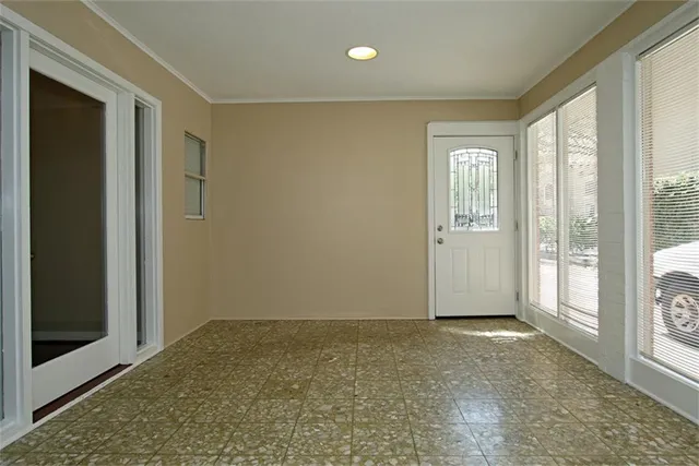 a view of an empty room and window