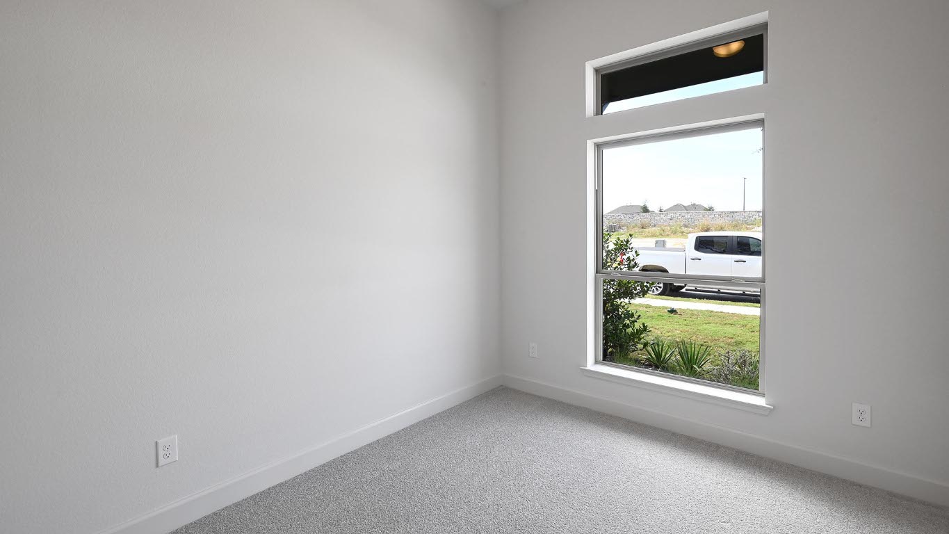 208 High Rock Pass Kyle, TX 78640 - Photo 16 of 40 Carpeted empty room with baseboards