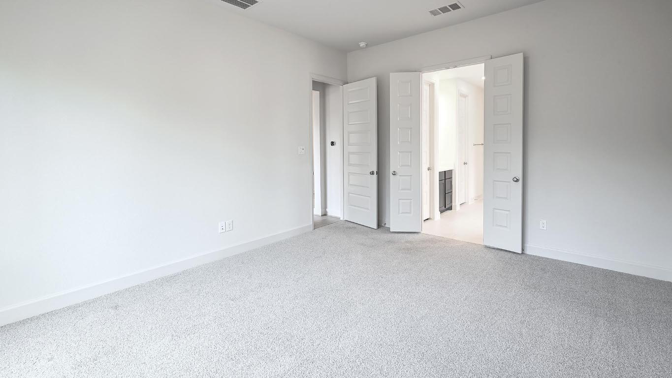 208 High Rock Pass Kyle, TX 78640 - Photo 18 of 40 Unfurnished bedroom with baseboards and carpet flooring