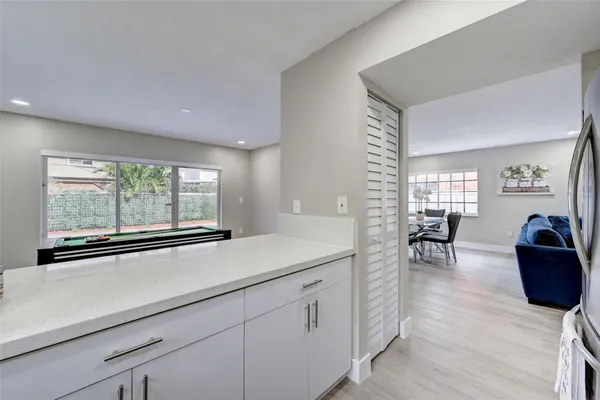 a kitchen with stainless steel appliances a stove a microwave a sink and cabinets