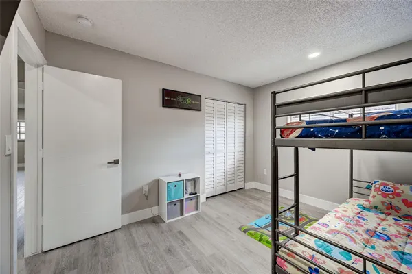a bedroom with bed and a window