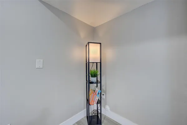 a view of an entryway with wooden floor
