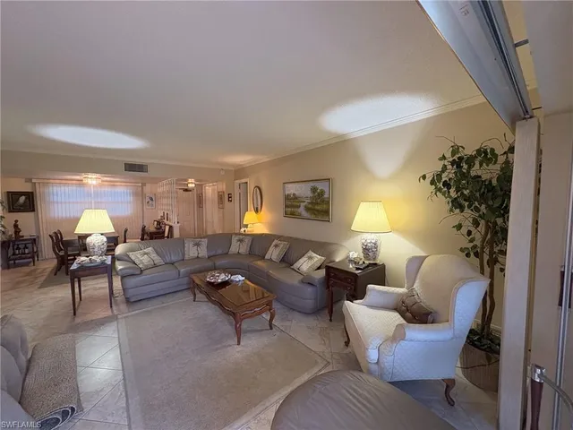 a view of a dining room with furniture and window