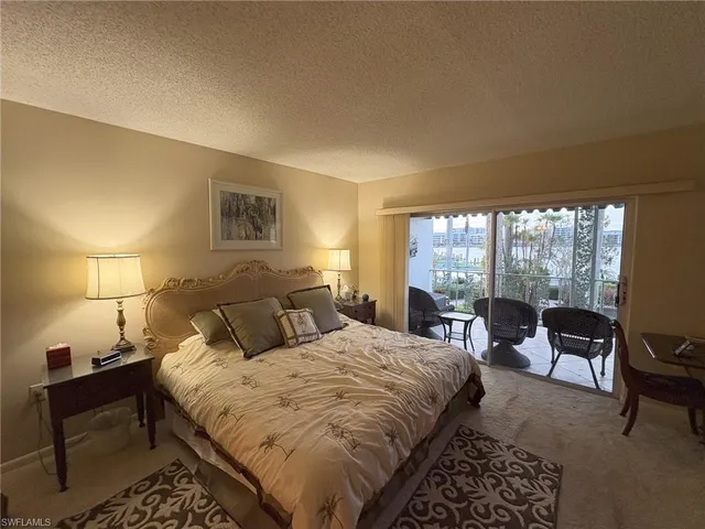 a bedroom with a bed and furniture