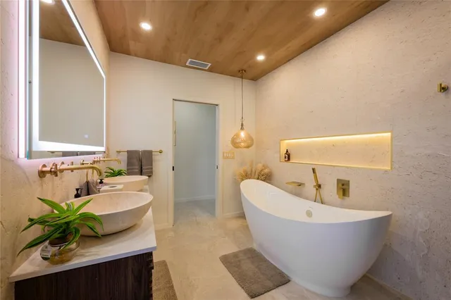 a bathroom with a bathtub and a sink