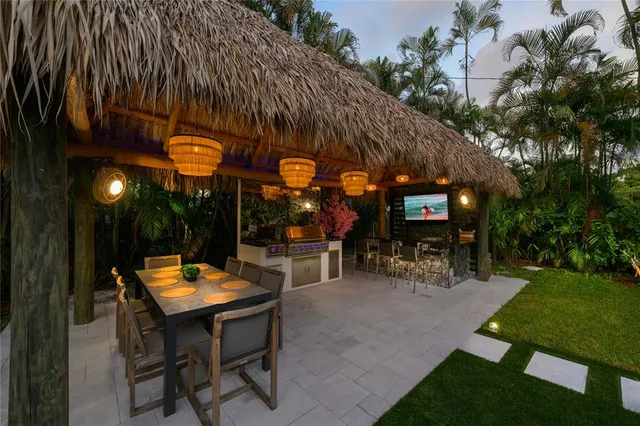 a view of a chairs and tables in a patio