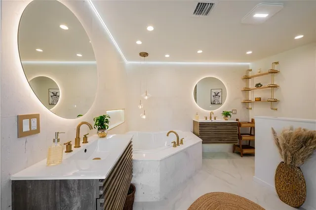 a living room with furniture and a mirror