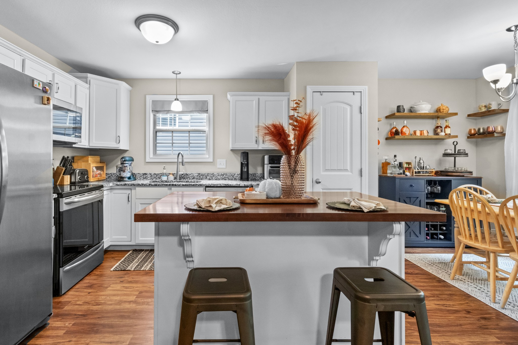 1129 Racker Drive Clarksville, TN 37043 - Photo 5 of 12 a kitchen with stainless steel appliances granite countertop a sink and a refrigerator
