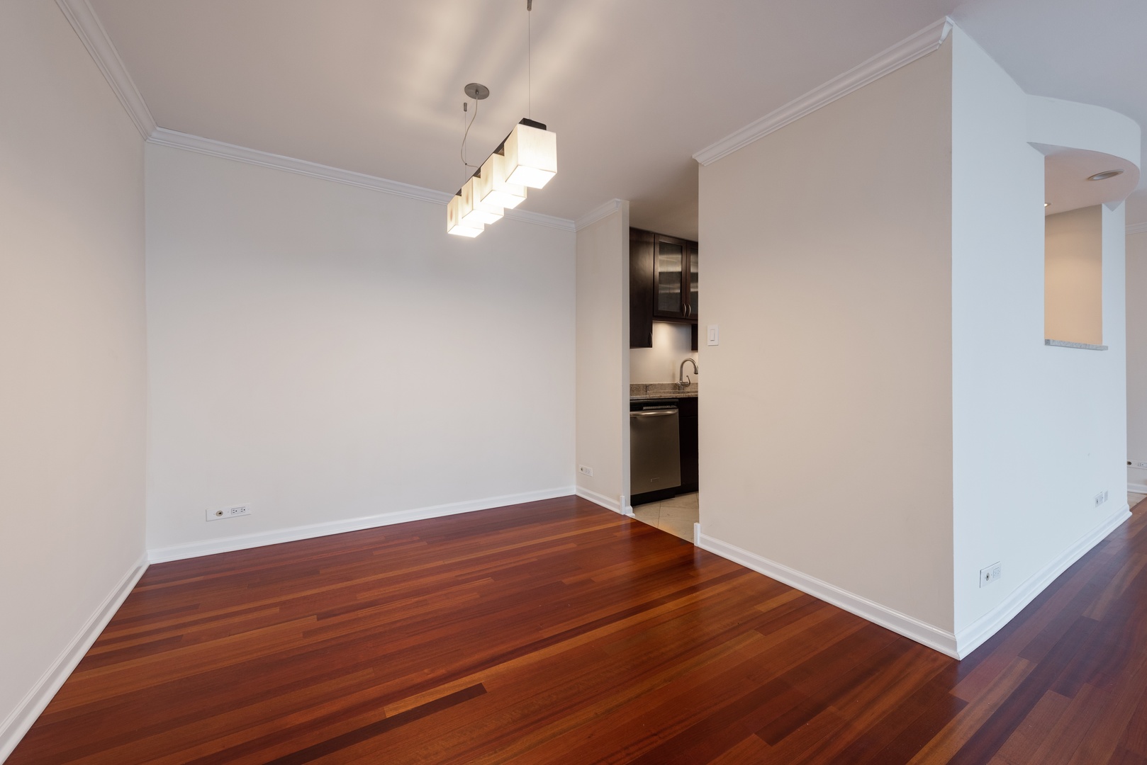 111 East Chestnut Street, Unit 45B Chicago, IL 60611 - Photo 7 of 27 a view of empty room with wooden floor