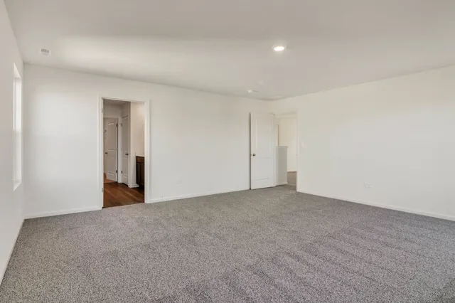 a view of a livingroom with furniture and a flat screen tv