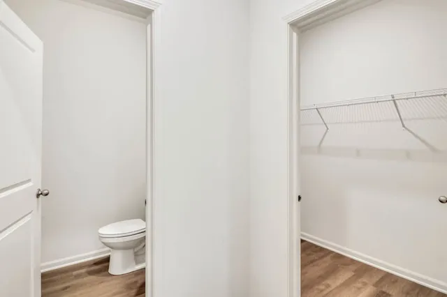 a bathroom with a shower and a glass door