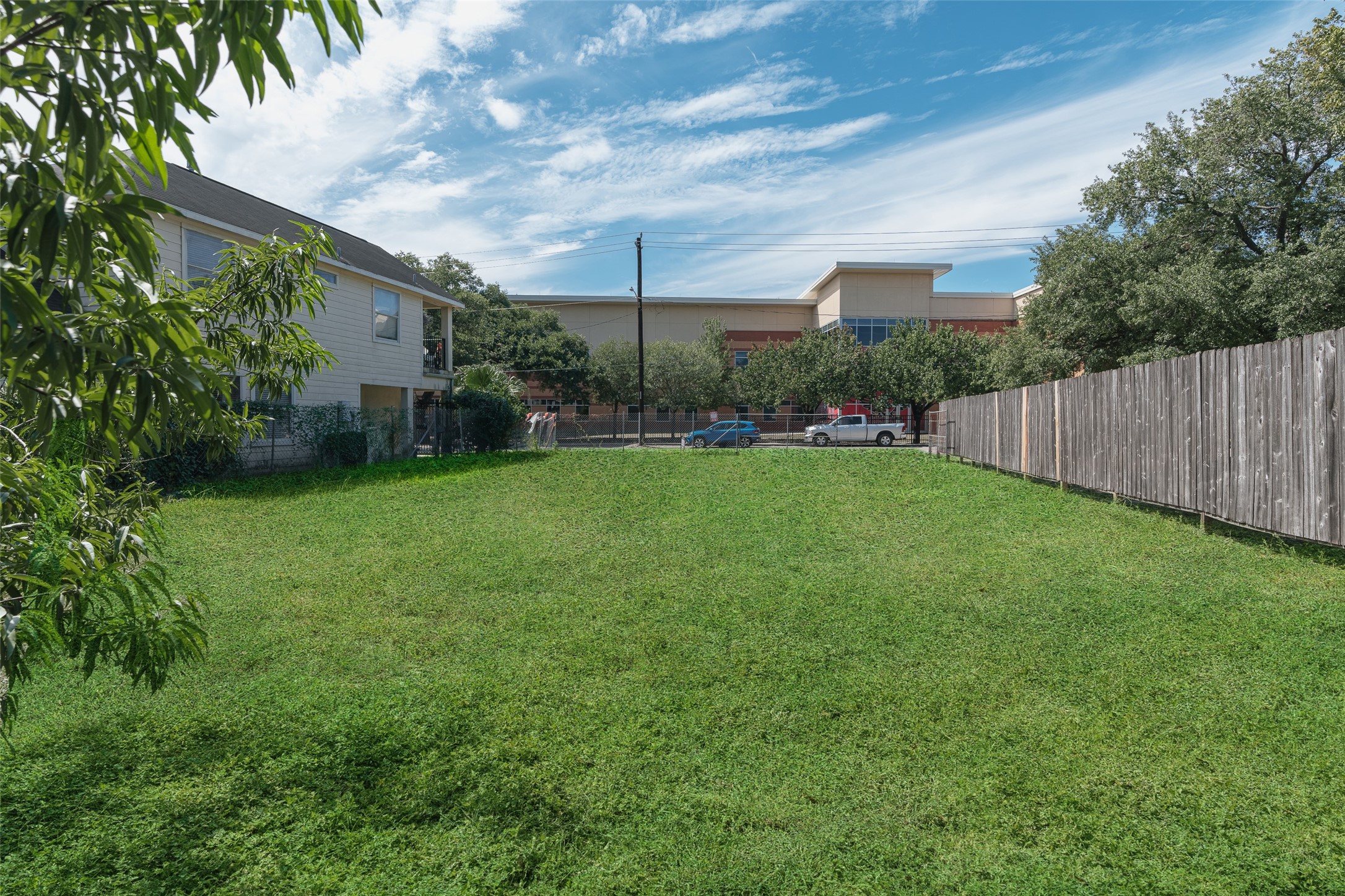 0 McKee Street Houston, TX 77009 - Photo 5 of 7 a view of a backyard with plants and large trees