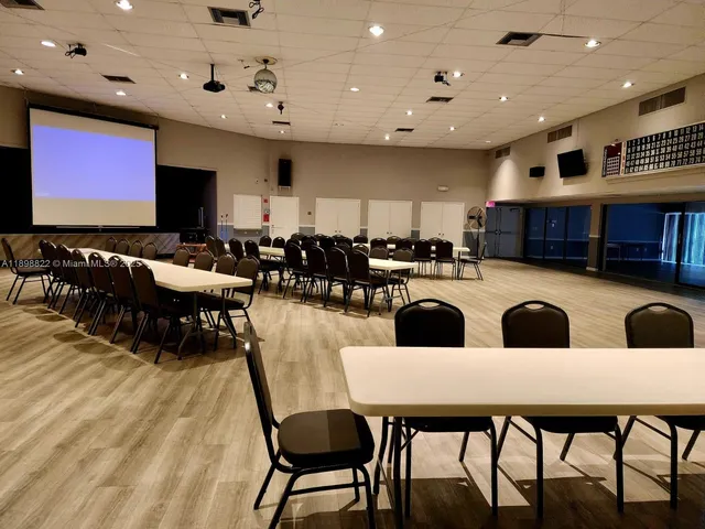 a view of an chairs and table in the patio