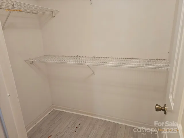 a view of a room with racks on the wall