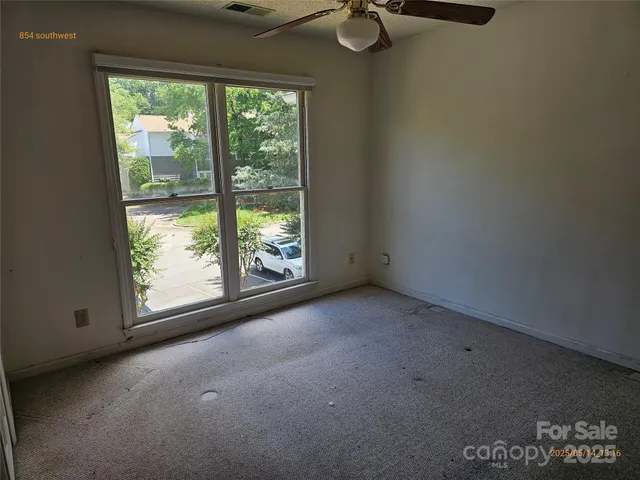 a view of a room that has a window in it
