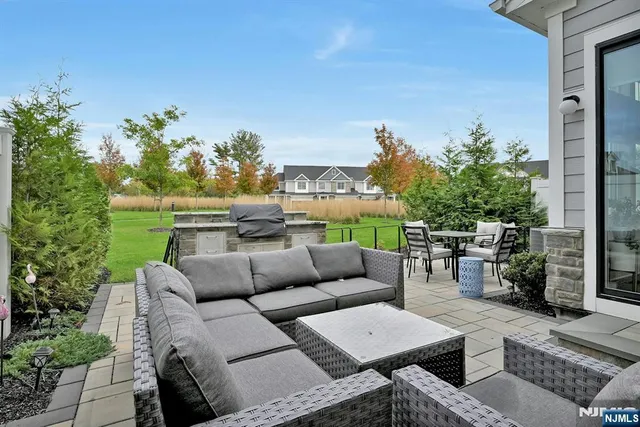 a view of a patio with couches and potted plants