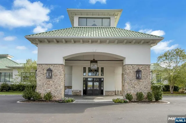 a front view of a house with a garage