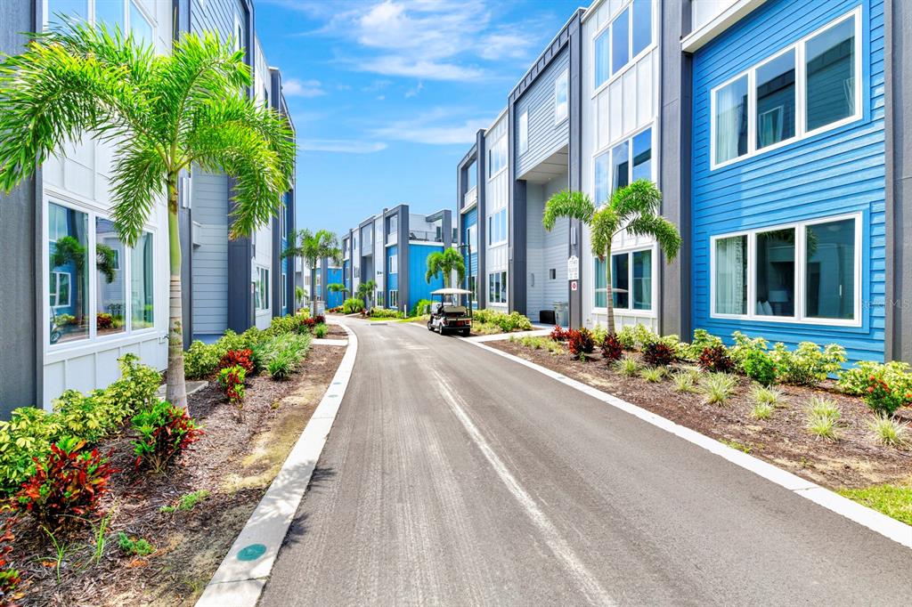 7740 Sandy Ridge Drive, Unit 220 Reunion, FL 34747 - Photo 2 of 55 a view of a building with potted plants
