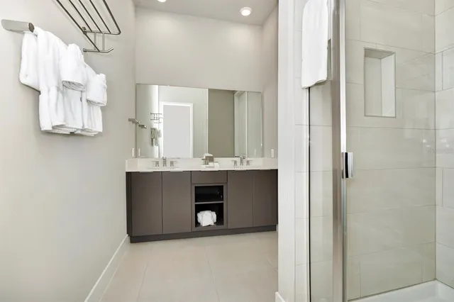 a bathroom with a sink vanity and a mirror