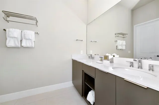 a bedroom with a bed and a cabinets