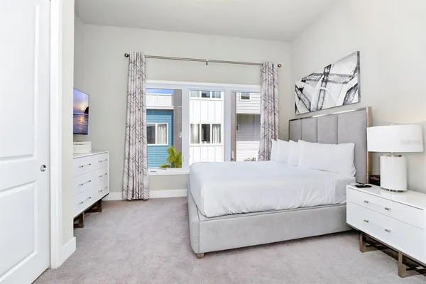 a view of a kitchen with sink and cabinets