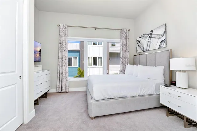 a view of a kitchen with sink and cabinets