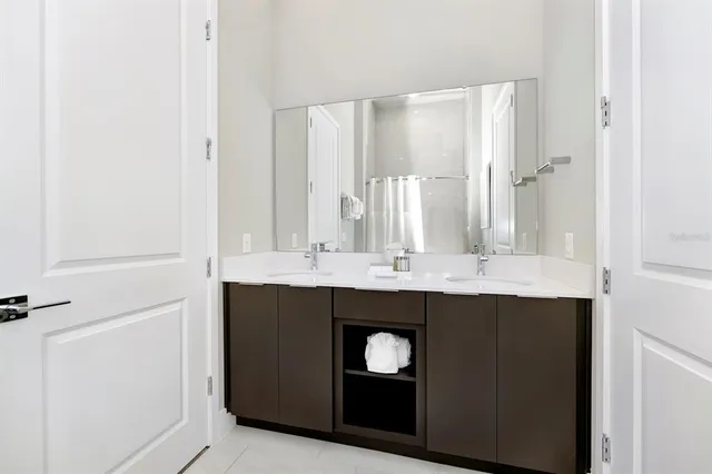 a bed room with a bed and a night stand