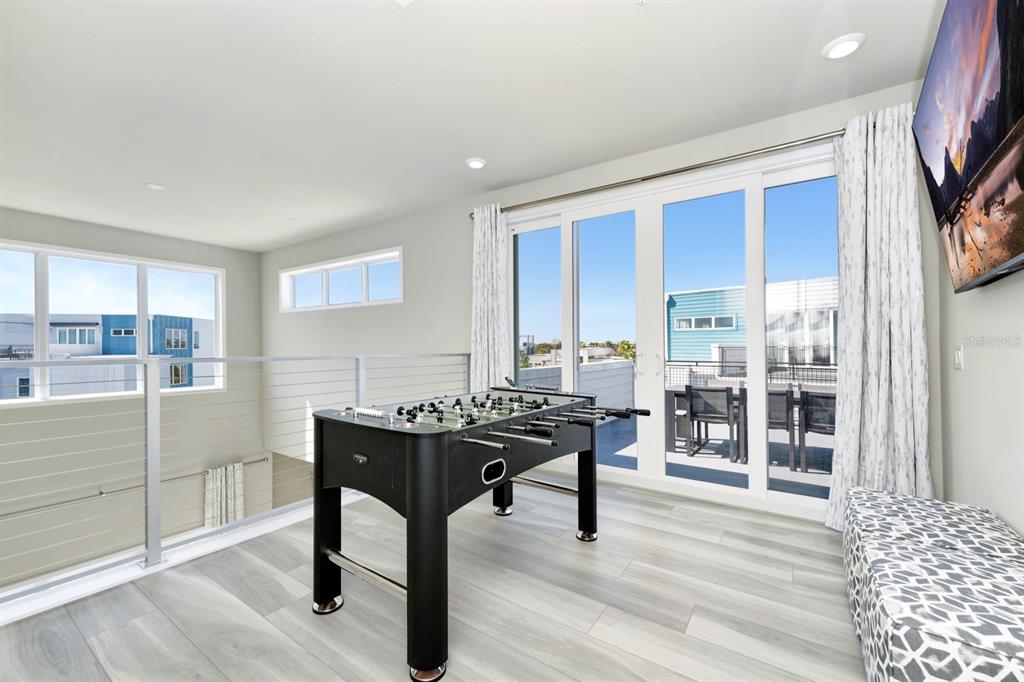 7740 Sandy Ridge Drive, Unit 220 Reunion, FL 34747 - Photo 35 of 55 a view of a workspace with furniture and wooden floor