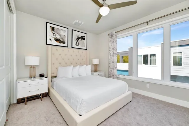 a bed room with a bed and a night stand