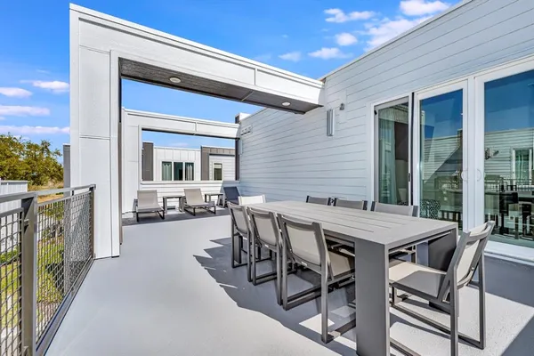 a view of a patio with a table and chairs