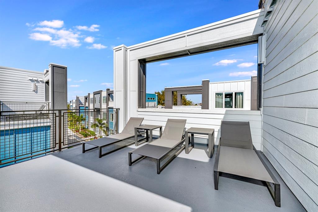 7740 Sandy Ridge Drive, Unit 220 Reunion, FL 34747 - Photo 45 of 55 a building outdoor space with patio furniture