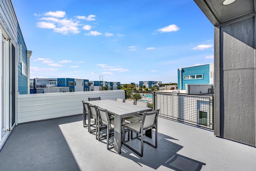 7740 Sandy Ridge Drive, Unit 220 Reunion, FL 34747 - Photo 46 of 55 a view of a patio with a table and chairs